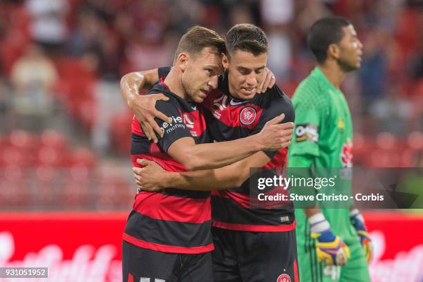 Brendon Santalab of the Wanderers celebrates scoring a goal with teammate Christopher Iknoomidis during the round 22 A-League match between the...