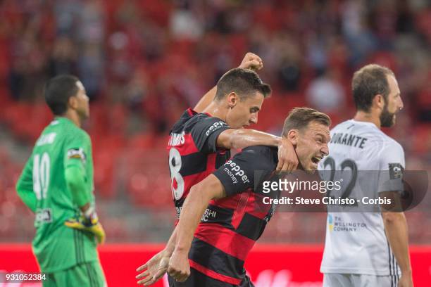 Brendon Santalab of the Wanderers celebrates scoring a goal with teammate Christopher Iknoomidis during the round 22 A-League match between the...