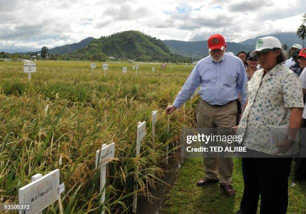 Princess Maha Chakri Sirindhorn of Thailand tours a rice field at the International Rice Research Institute during a visit in the town of Los Banos,...