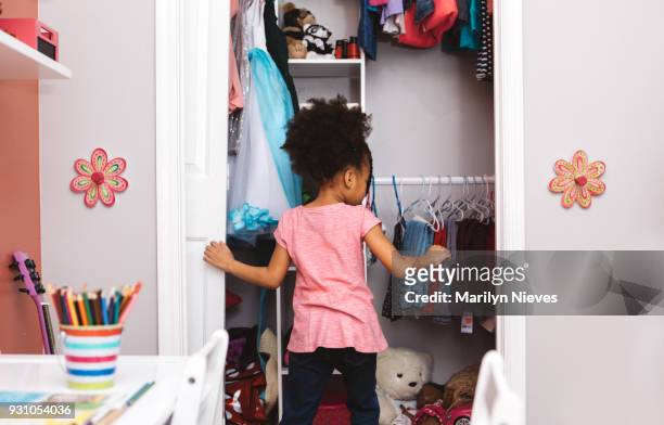 little girl getting ready for school - childrens closet stock pictures, royalty-free photos & images