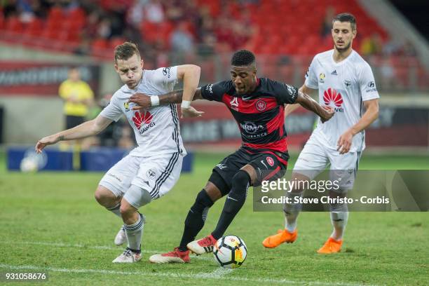 Rolieny Bonevacia of the Wanderers is challenged by Phoenix's Scott Galloway during the round 22 A-League match between the Western Sydney Wanderers...