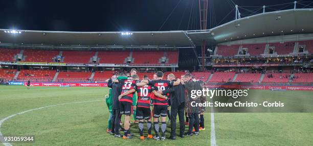 Wanderers celebrate their 4-1 win over the Phoenix with a team huddle after the round 22 A-League match between the Western Sydney Wanderers and the...