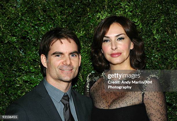 Driver Jeff Gordon and his wife model Ingrid Vandebosch pose for a photo at the CFDA/Vogue Fashion Fund Awards at Skylight Studio on November 16,...