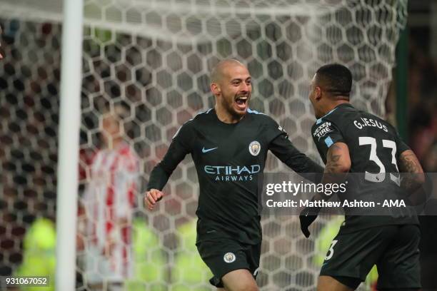 David Silva of Manchester City celebrates after scoring a goal to make it 2-0 during the Premier League match between Stoke City and Manchester City...