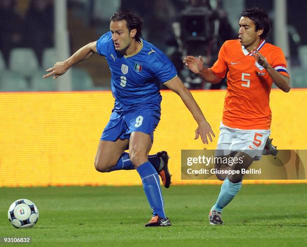 Alberto Gilardino of Italy and Giovanni van Bronckhorst of Holland in action during the International Friendly Match between Italy and Holland at...