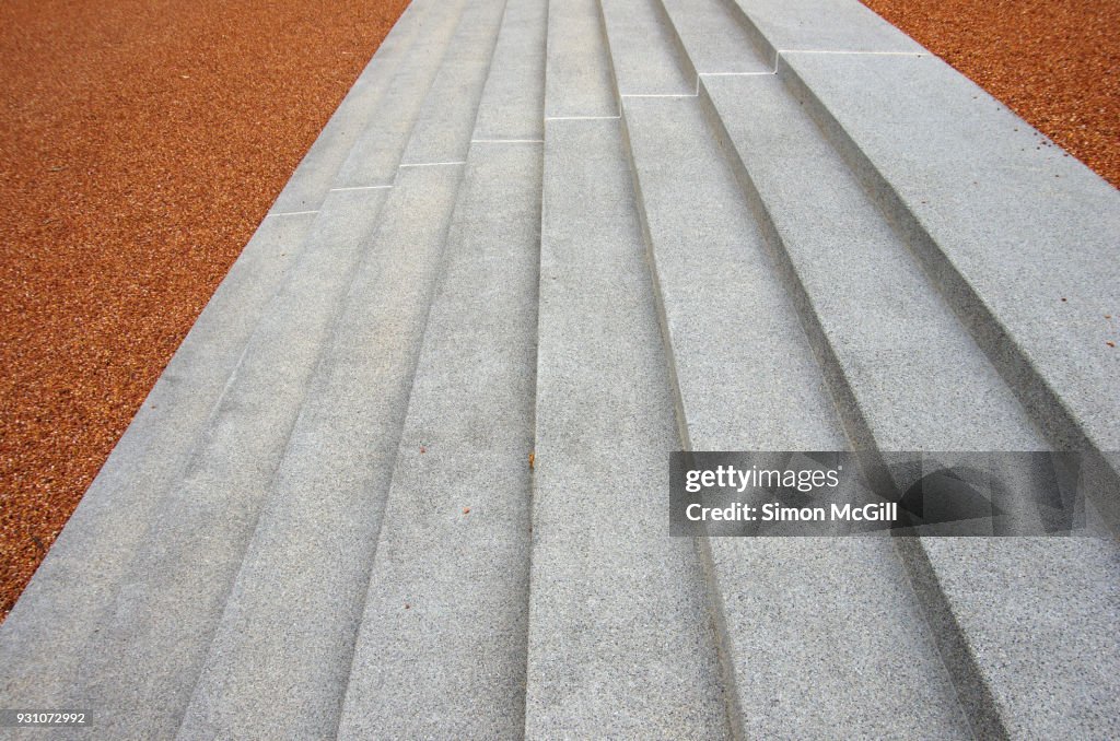 Cement steps and decorative red scoria gravel