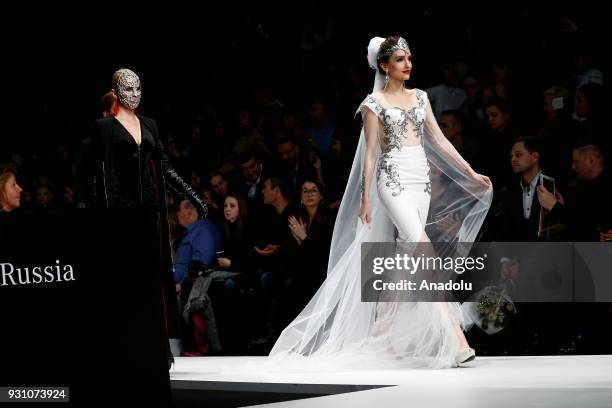 Model presents a creation by Slava Zaitsev presents Fashion Laboratory during the Mercedes-Benz Fashion Week in Moscow, Russia on March 12, 2018.
