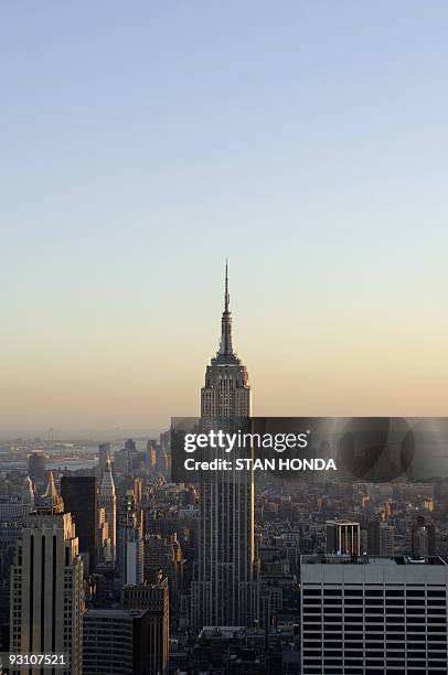 The Empire State Building rises above the Manhattan skyline at sunset, 29 April 2006, in New York. 01 May 2006 marks the 75th anniversary of the...