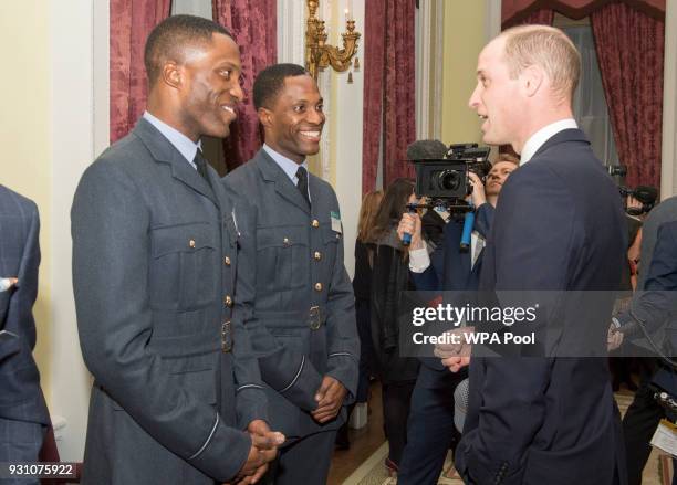 Prince William, Prince of Cambridge talks with Flying Officer Charles and Colin Ihe from the RAF during the 2018 Commonwealth Day reception at...