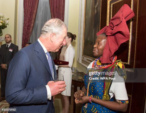 Prince Charles, Prince of Wales meets a guest during the 2018 Commonwealth Day reception at Marlborough House on March 12, 2018 in London, England.