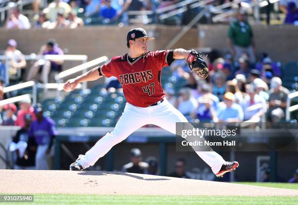 Kris Medlen of the Arizona Diamondbacks delivers a first inning pitch during a spring training game against the Colorado Rockies at Salt River Fields...