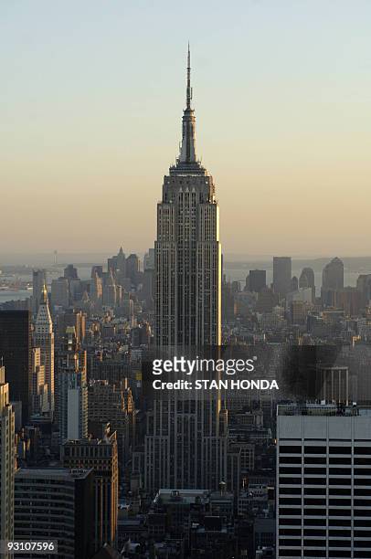The Empire State Building rises above the Manhattan skyline at sunset, 29 April 2006, in New York. 01 May 2006 marks the 75th anniversary of the...