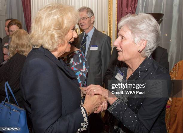 Camilla, Duchess of Cornwall meets Louise Martin during the 2018 Commonwealth Day reception at Marlborough House on March 12, 2018 in London, England.
