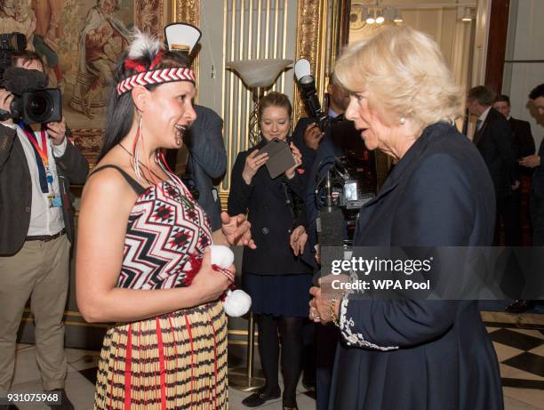 Camilla, Duchess of Cornwall meets a performer during the 2018 Commonwealth Day reception at Marlborough House on March 12, 2018 in London, England.