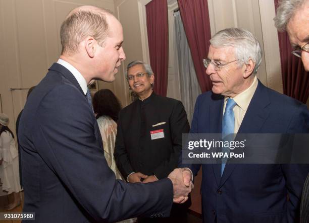 Prince William, Prince of Cambridge meets Sir John Major during the 2018 Commonwealth Day reception at Marlborough House on March 12, 2018 in London,...