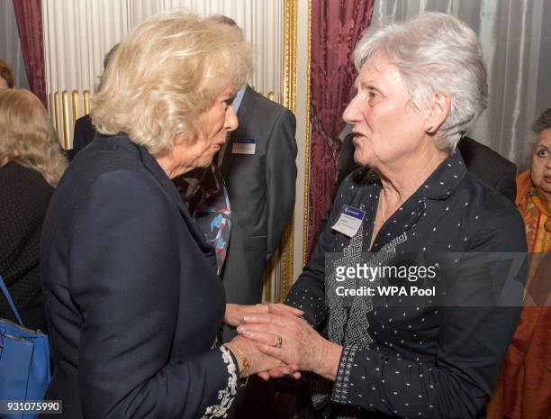 Camilla, Duchess of Cornwall meets Louise Martin during the 2018 Commonwealth Day reception at Marlborough House on March 12, 2018 in London, England.