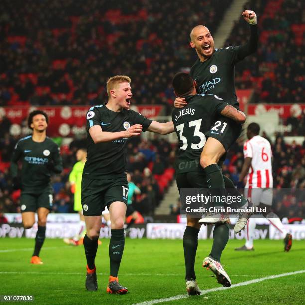 David Silva of Manchester CIty celebrates scoring his side's second goal during the Premier League match between Stoke City and Manchester City at...