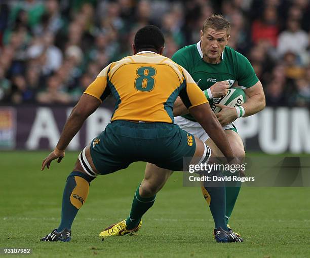 Jamie Heaslip of Ireland takes on Wycliff Palu during the rugby union international match between Ireland and Australia at Croke Park on November 15,...