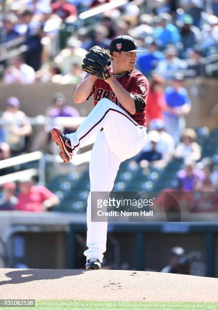 Kris Medlen of the Arizona Diamondbacks delivers a first inning pitch during a spring training game against the Colorado Rockies at Salt River Fields...