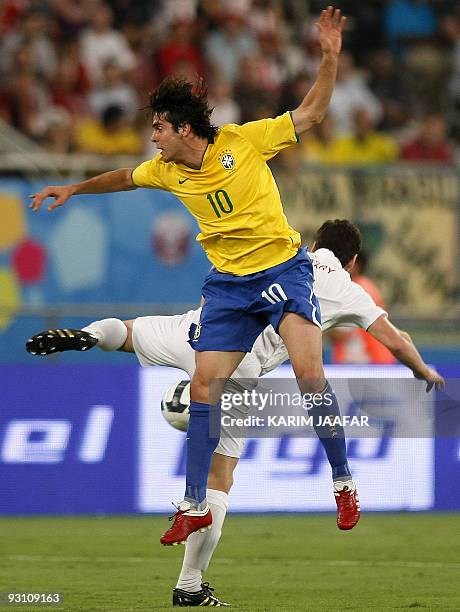 Brazil's Kaka challenges England's Gareth Barry during their friendly football match at the Khalifa Stadium in the Qatari capital Doha on November...