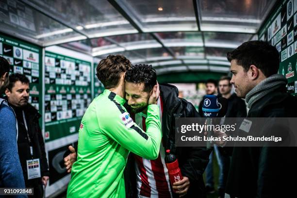 Claudio Pizarro of Koeln hugs a player of Bremen during an interview in the players tunnel after the Bundesliga match between SV Werder Bremen and 1....