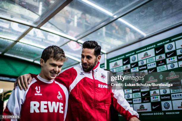 Claudio Pizarro talks to Vincent Koziello during their arrival in the player tunnel prior to the Bundesliga match between SV Werder Bremen and 1. FC...