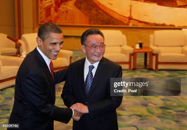 President Barack Obama shakes hands with Wu Bangguo, Chairman of China's National People's Congress, prior to their talks at the Great Hall of the...