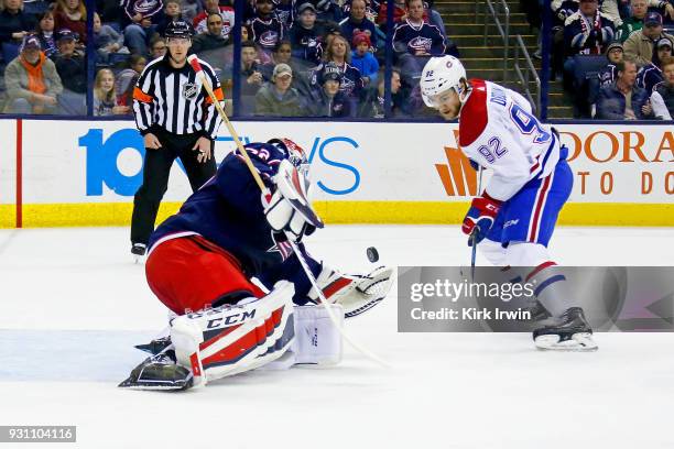 Sergei Bobrovsky of the Columbus Blue Jackets stops a shot from Jonathan Drouin of the Montreal Canadiens during the first period on March 12, 2018...