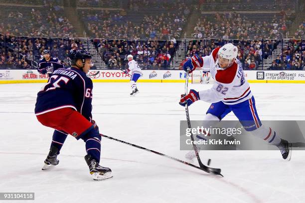 Markus Nutivaara of the Columbus Blue Jackets blocks a shot by Artturi Lehkonen of the Montreal Canadiens during the first period on March 12, 2018...