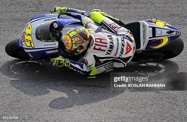 Italy's Valentino Rossi of Fiat Yamaha rides during the second free practice session of the Malaysian Motocycle Grand Prix in Sepang on October 24,...