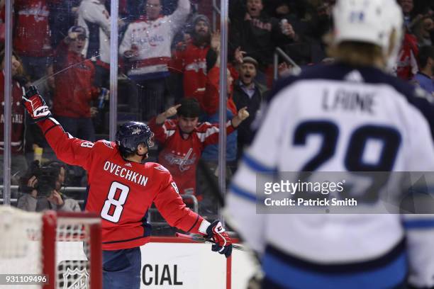 Alex Ovechkin of the Washington Capitals celebrates after scoring his 600th career goal against the Winnipeg Jets during the second period at Capital...