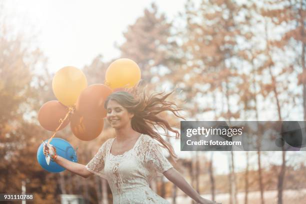 happy woman - red dress run stock pictures, royalty-free photos & images