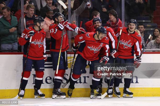 Alex Ovechkin of the Washington Capitals celebrates with teammates after scoring his 600th career goal against the Winnipeg Jets during the second...
