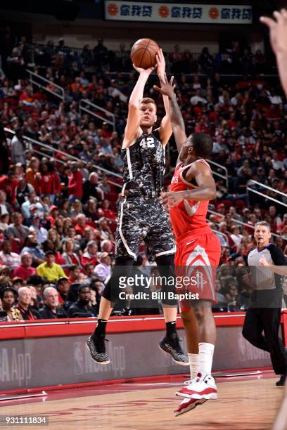 Davis Bertans of the San Antonio Spurs shoots the ball against the Houston Rockets on March 12, 2018 at the Toyota Center in Houston, Texas. NOTE TO...