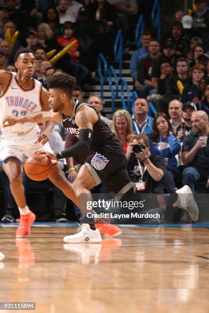 Frank Mason III of the Sacramento Kings handles the ball against the Oklahoma City Thunder on March 12, 2018 at Chesapeake Energy Arena in Oklahoma...