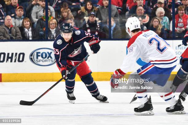 Mark Letestu of the Columbus Blue Jackets skates with the puck as Mike Reilly of the Montreal Canadiens defends during the third period of a game on...