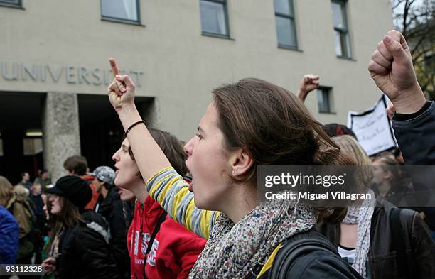 Students shout slogans as they walk past the university of technology during a protest march on November 17, 2009 in Munich, Germany. Following...
