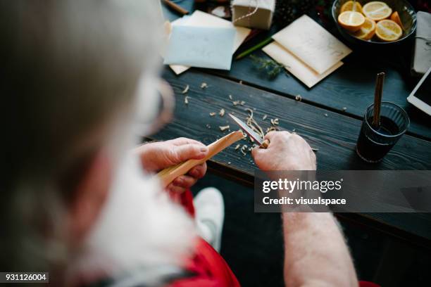 santa claus doing wood work - santas workshop stock pictures, royalty-free photos & images