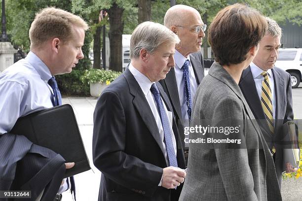 Henry Paulson, U.S. Treasury secretary, third from the right, along with members of the Treasury, from left, James Wilkinson, chief of staff, Kevin...