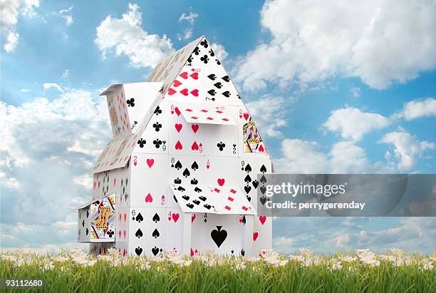 card house against blue skies - card house stock pictures, royalty-free photos & images