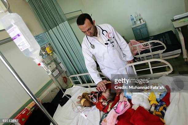 Iraqi Dr. Aiman Qeis cares for children at Falluja General Hospital on November 12, 2009 in the city of Falluja west of Baghdad, Iraq. Birth defects...