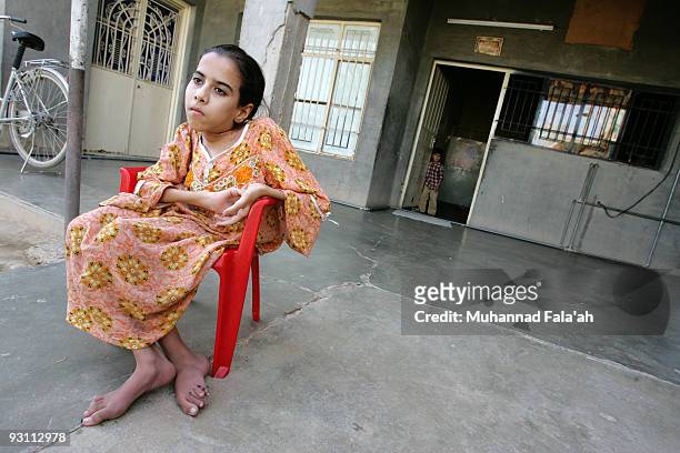 Inas Hamed who suffers from a birth defect is pictured on November 12, 2009 at her house in the city of Falluja west of Baghdad, Iraq. Birth defects...