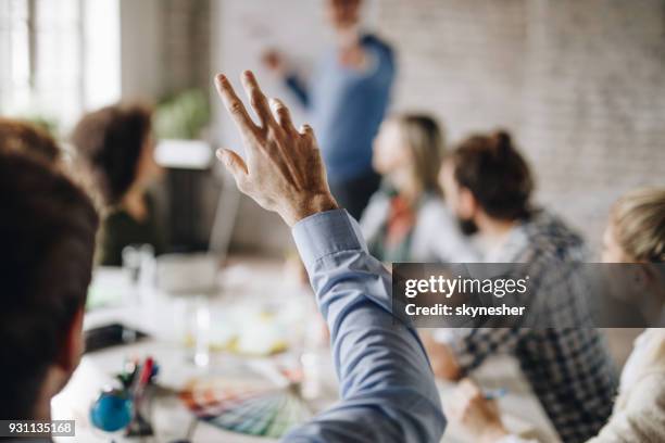 unrecognizable businessman asking a question on a meeting in the office. - perguntar imagens e fotografias de stock