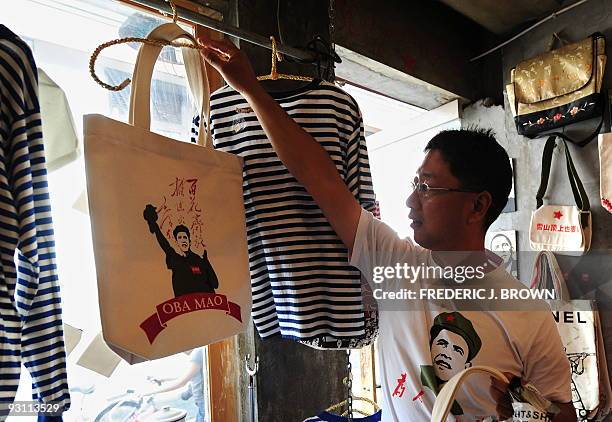 Designer and entrepreneur Liu Mingjie wears his "Oba Mao" T-shirt in which he superimposed the face of US President Barack Obama over that of China's...