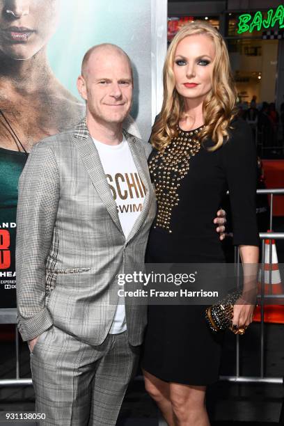 Tom Holkenborg aka Junkie XL and guest attend the premiere of Warner Bros. Pictures' "Tomb Raider" at TCL Chinese Theatre on March 12, 2018 in...