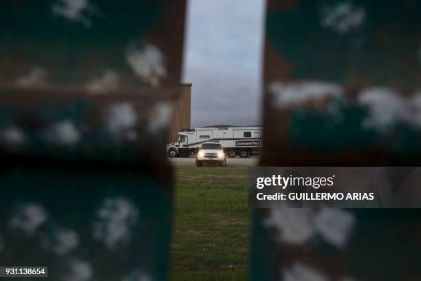 The Border Patrol stands guards the US-Mexico border on the outskirts of San Diego, in the US, near prototypes of the wall US President Donald Trump...