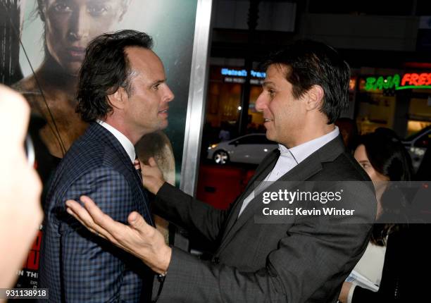 Walton Goggins and President of Metro-Goldwyn-Mayer Jonathan Glickman attend the premiere of Warner Bros. Pictures' "Tomb Raider" at TCL Chinese...