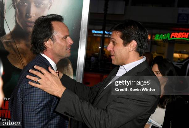 Walton Goggins and President of Metro-Goldwyn-Mayer Jonathan Glickman attend the premiere of Warner Bros. Pictures' "Tomb Raider" at TCL Chinese...