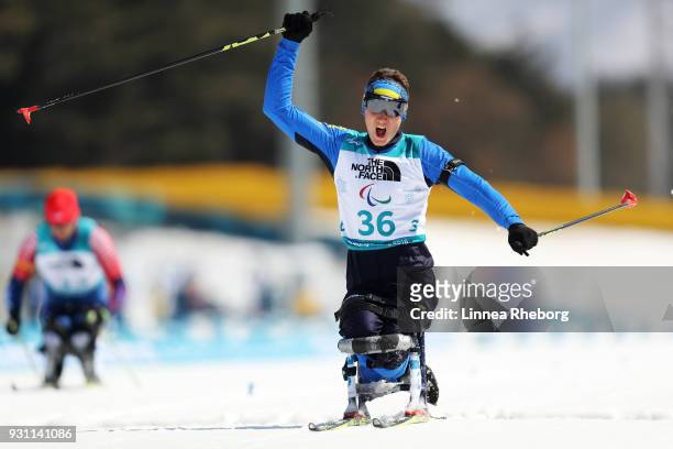 Taras Rad of Ukraine celebrates victory in the Men's Biathlon 12.5km Sitting on day four of the PyeongChang 2018 Paralympic Games on March 13, 2018...