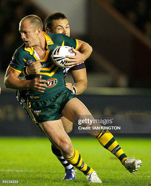Darren Lockyer captain of Australia is tackled by Jarred Waerea-Hargreaves of New Zealand during a Four Nations Rugby League Group match at the...